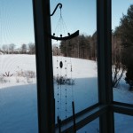 wind chimes singing on the screen porch
